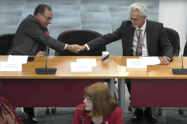 Cllr Ranjit Gill (right) shakes hands with a new Labour colleague 