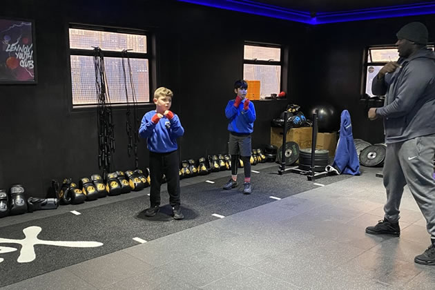 Two ten-year-old boys train at Lennox boxing gym
