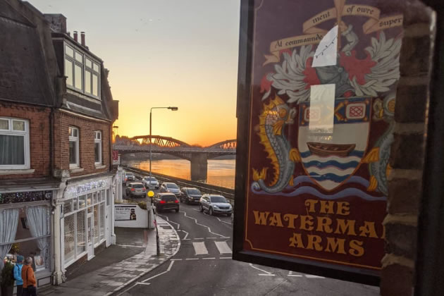 The Watermans Arms with Barnes Bridge in the background